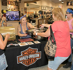 Woman winning a prize at superstition harley